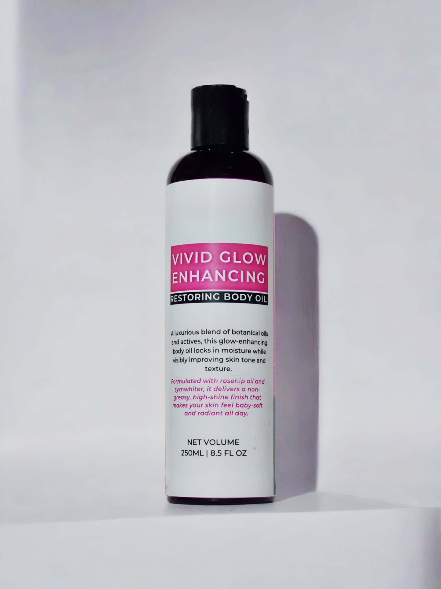 Vivid glow restoring body oil bottle showcasing its luxurious blend of botanical oils for skin nourishment and radiance.