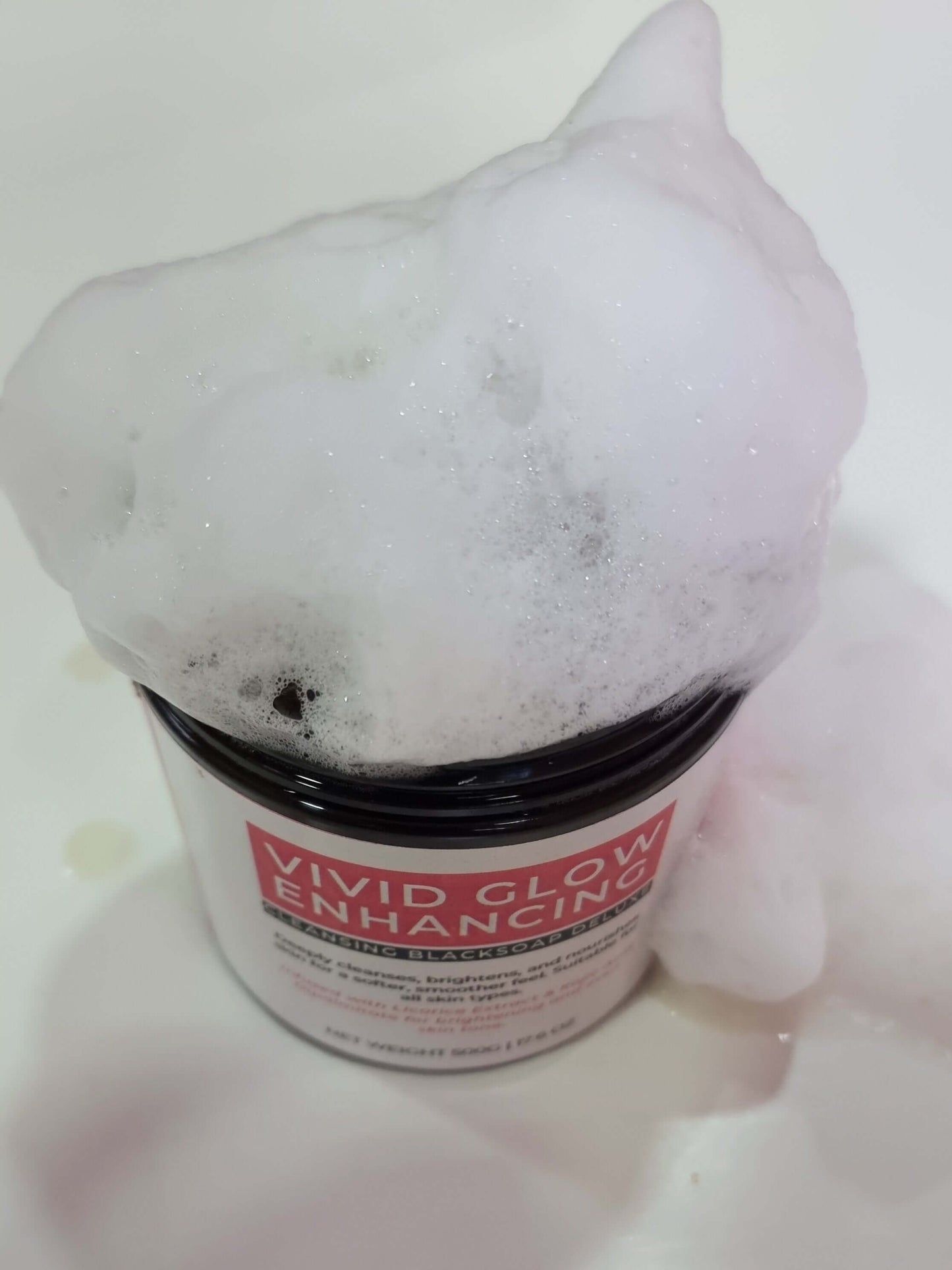 VIVID GLOW GLOW BLACK SOAP DELUXE OFFER with bubbly lather for brightening and cleansing skin.