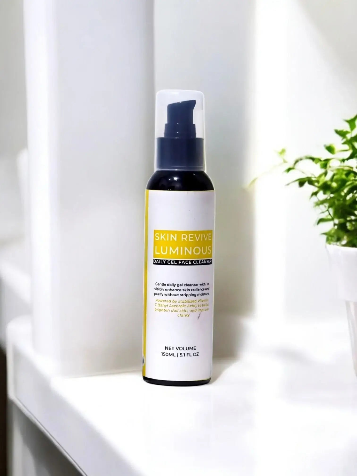 SKIN REVIVE LUMINOUS FACE TONER bottle displayed on a white surface with plants in the background.