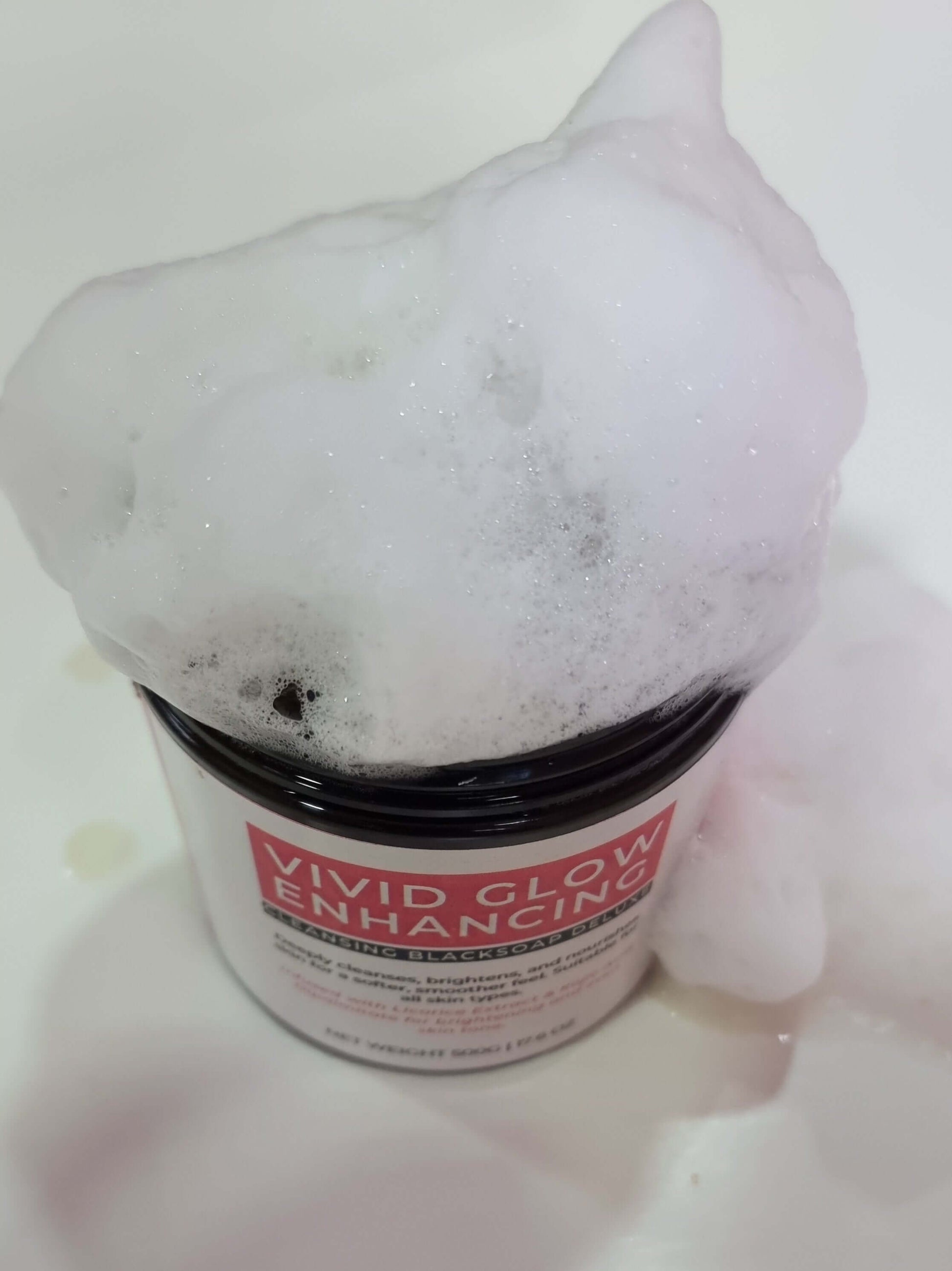 VIVID GLOW GLOW BLACK SOAP DELUXE OFFER with bubbly lather for brightening and cleansing skin.
