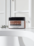 Café Luxe Radiance Coffeesoap Deluxe in a sleek container on a white surface, highlighting its nourishing formula.