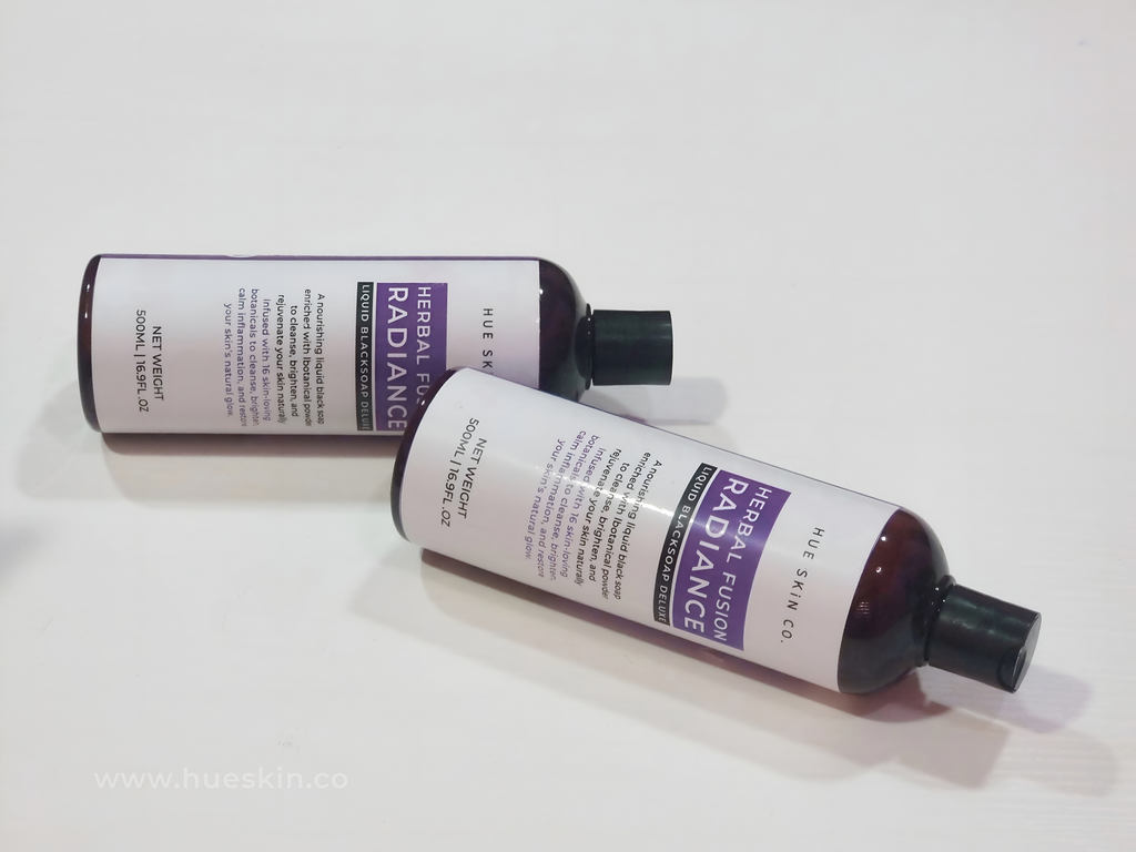 Hue Skin Liquid Black Soap – Herbal Fusion Radiance bottles on a white background.